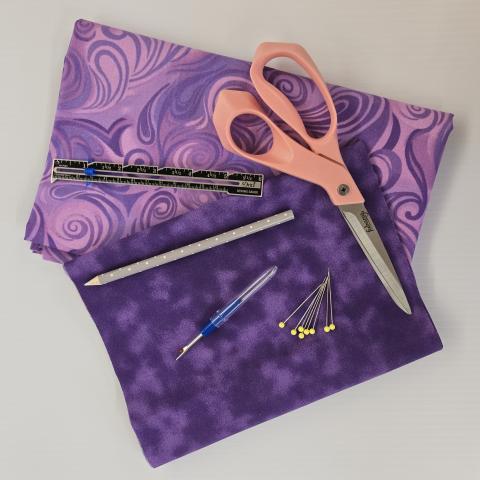 Picture of sewing supplies and fabric.