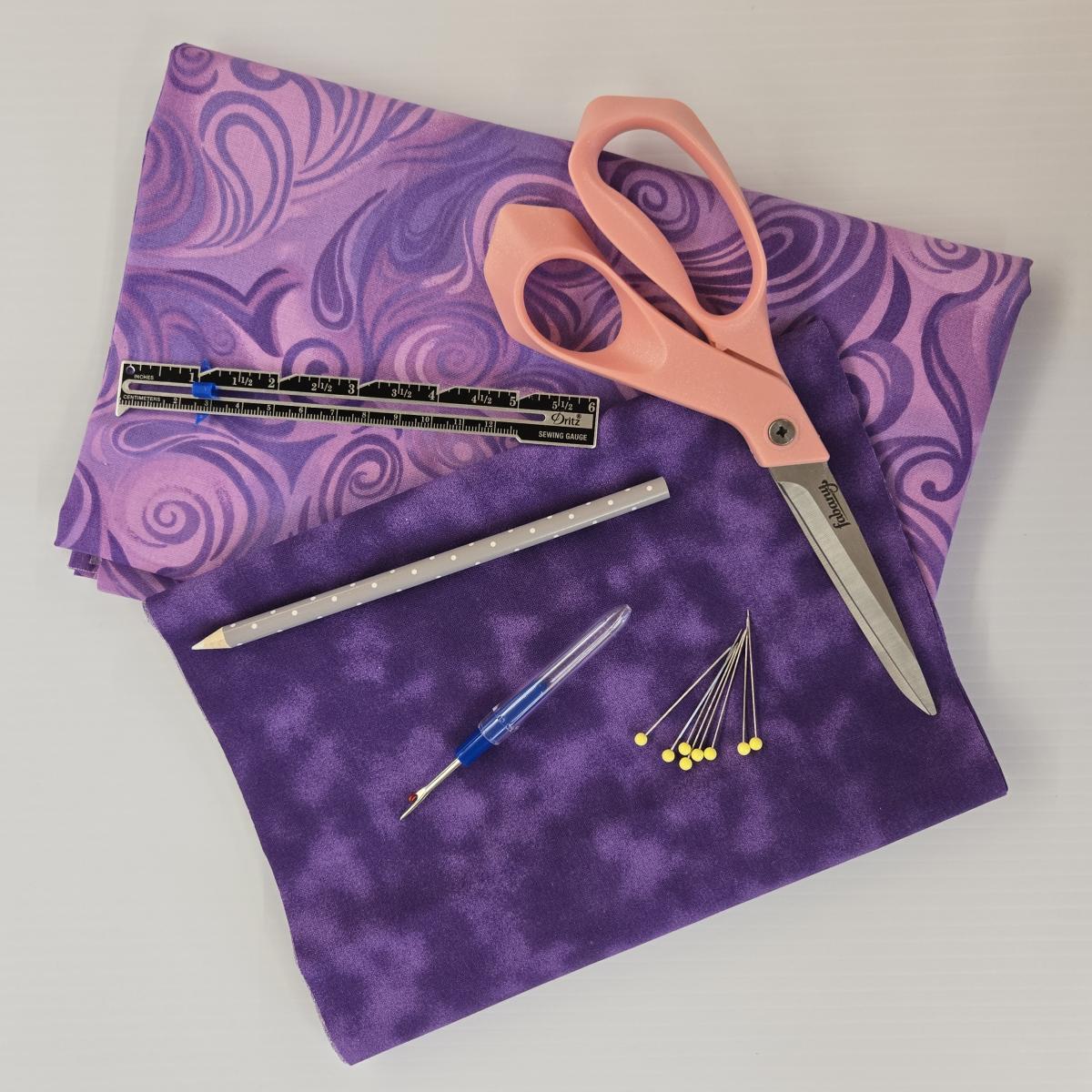 Picture of sewing supplies and fabric.